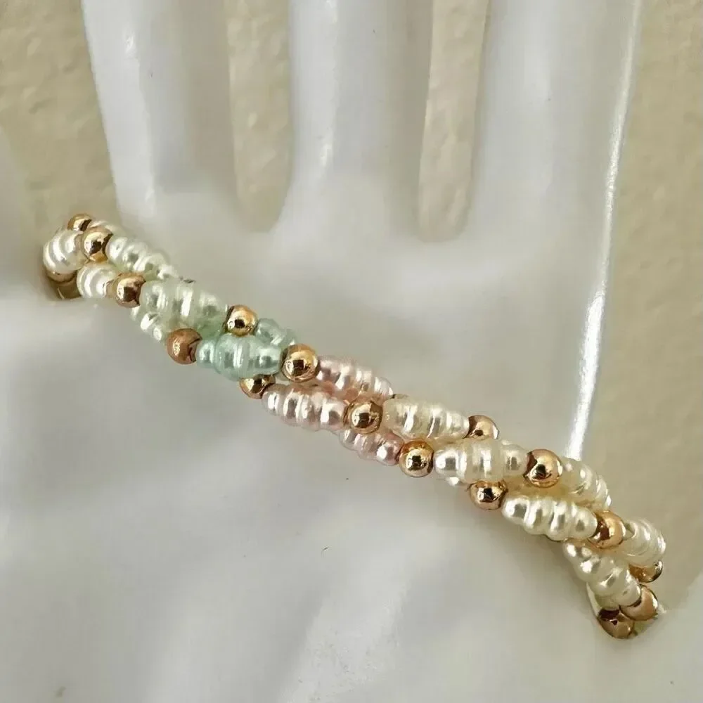 Faux pearl twisted multi strand bracelet